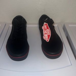 Those are some cool vans with a fire design on the side !